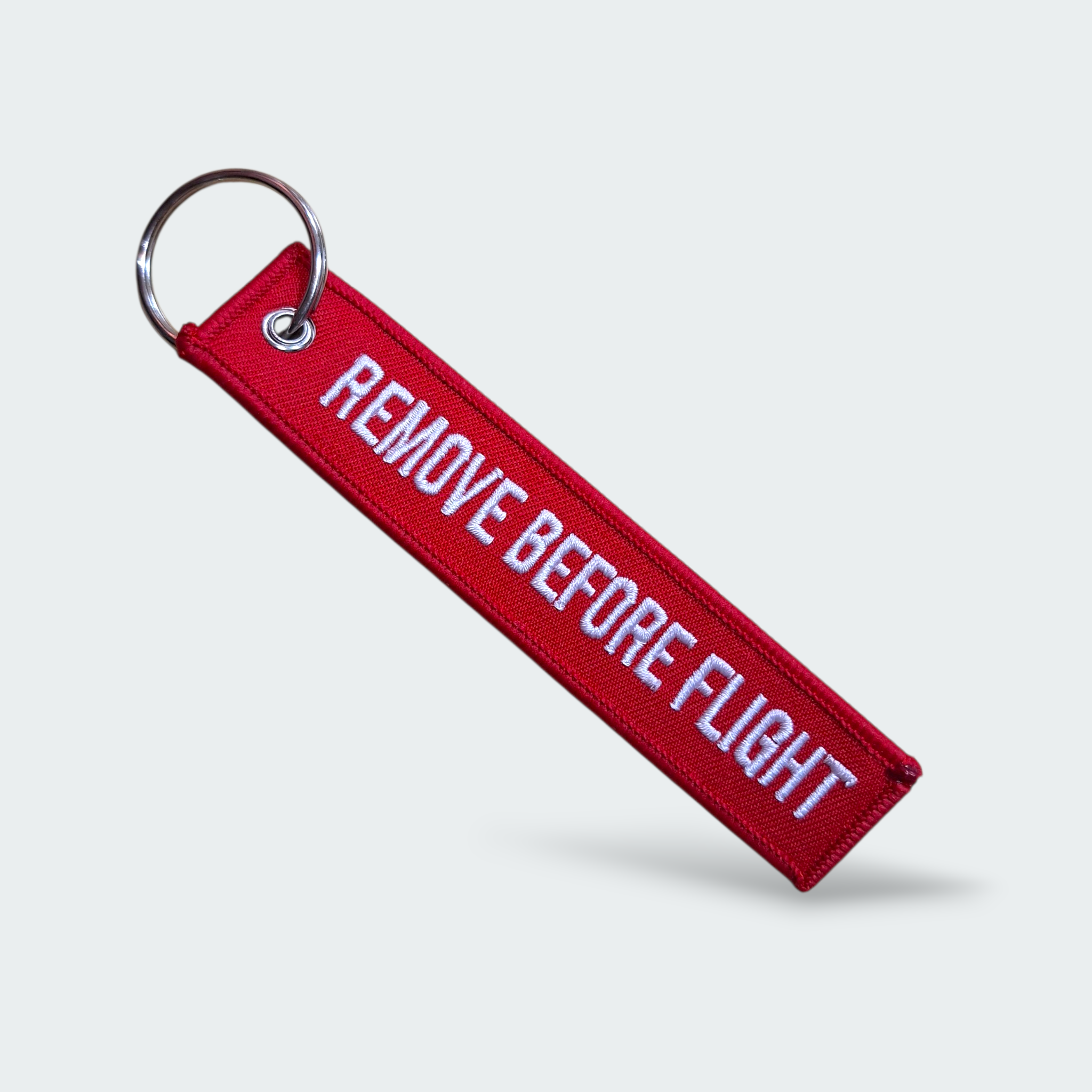 LLAVERO  REMOVE BEFORE FLIGHT ROJO