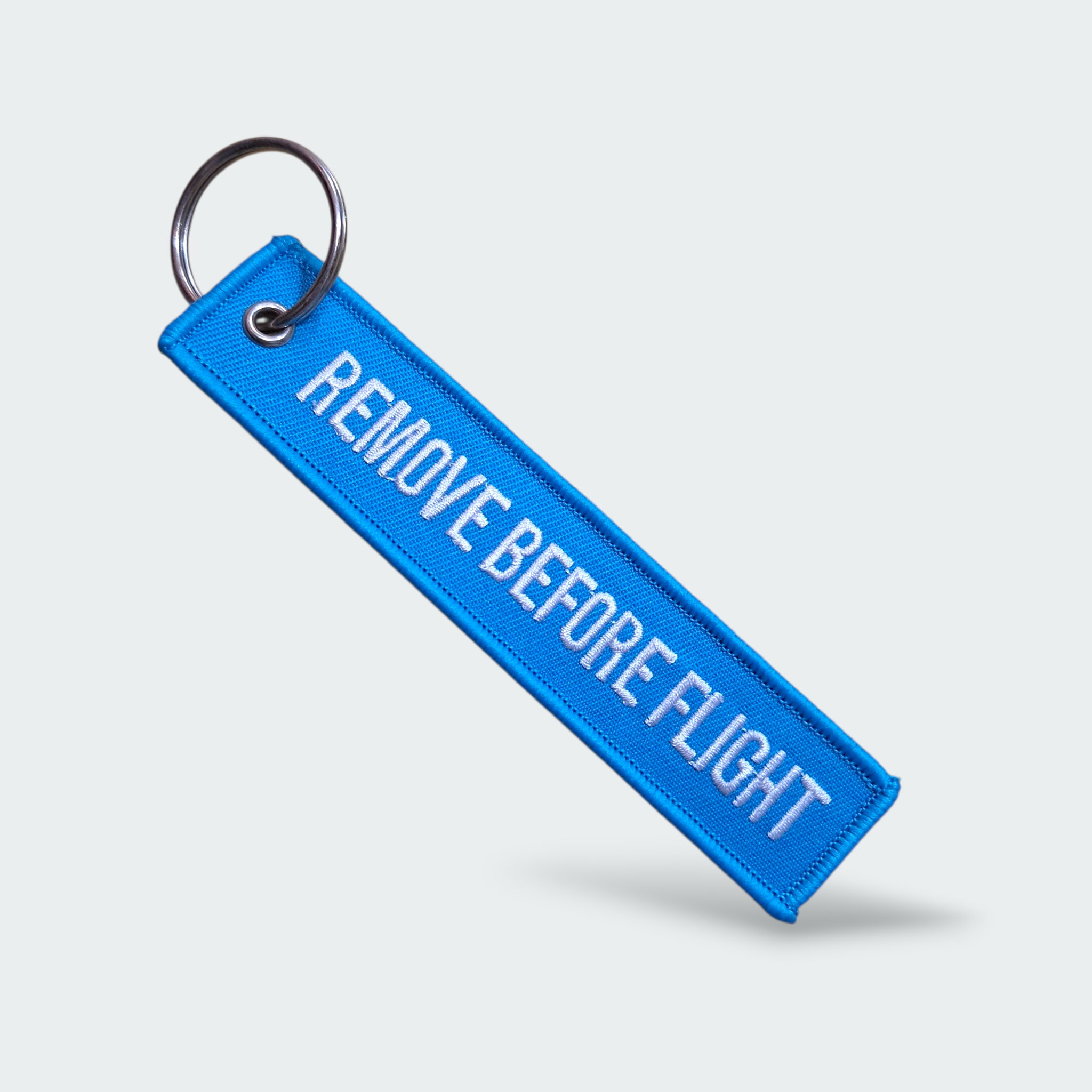 LLAVERO REMOVE BEFORE FLIGHT AZUL CLARO