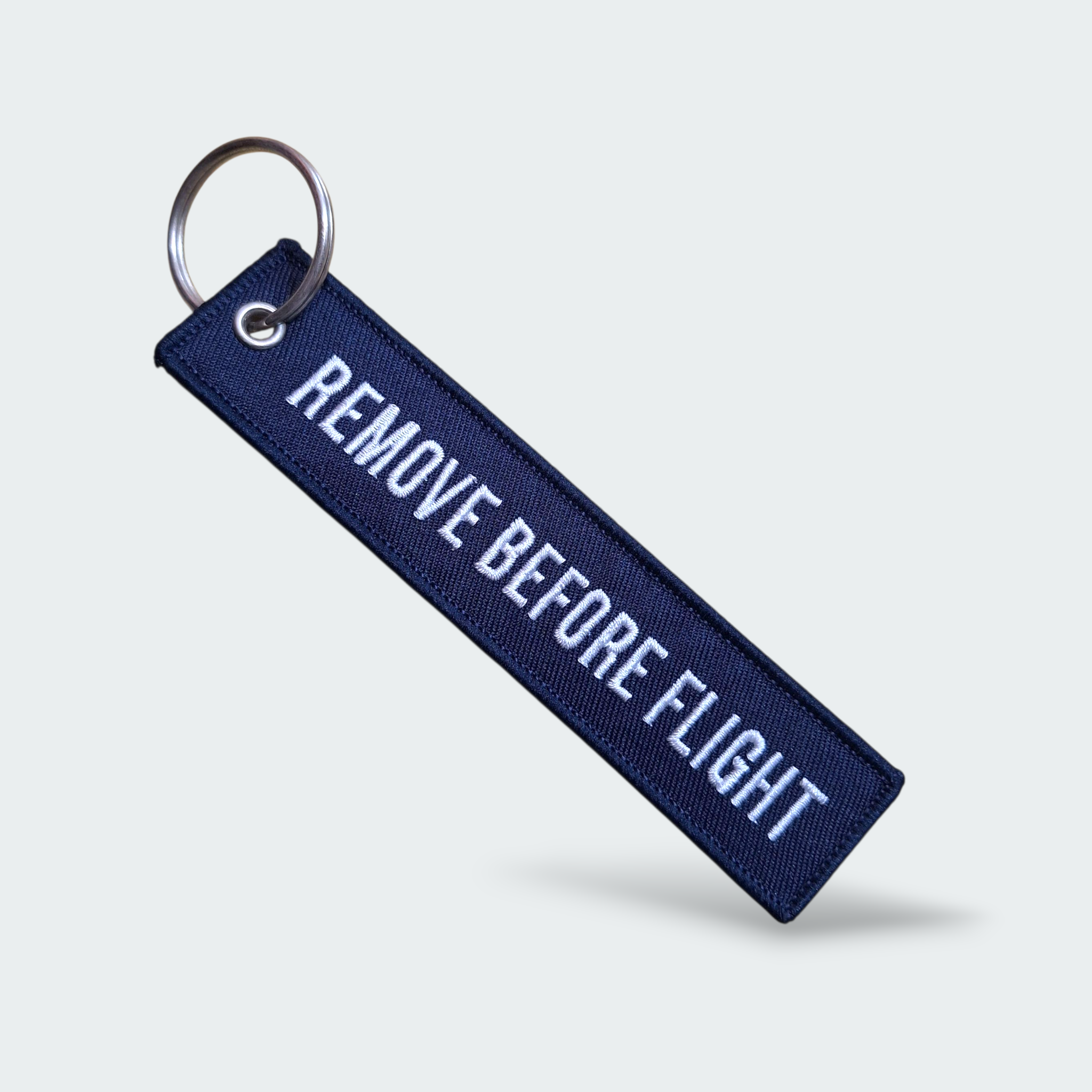 LLAVERO REMOVE BEFORE FLIGHT AZUL NAVY