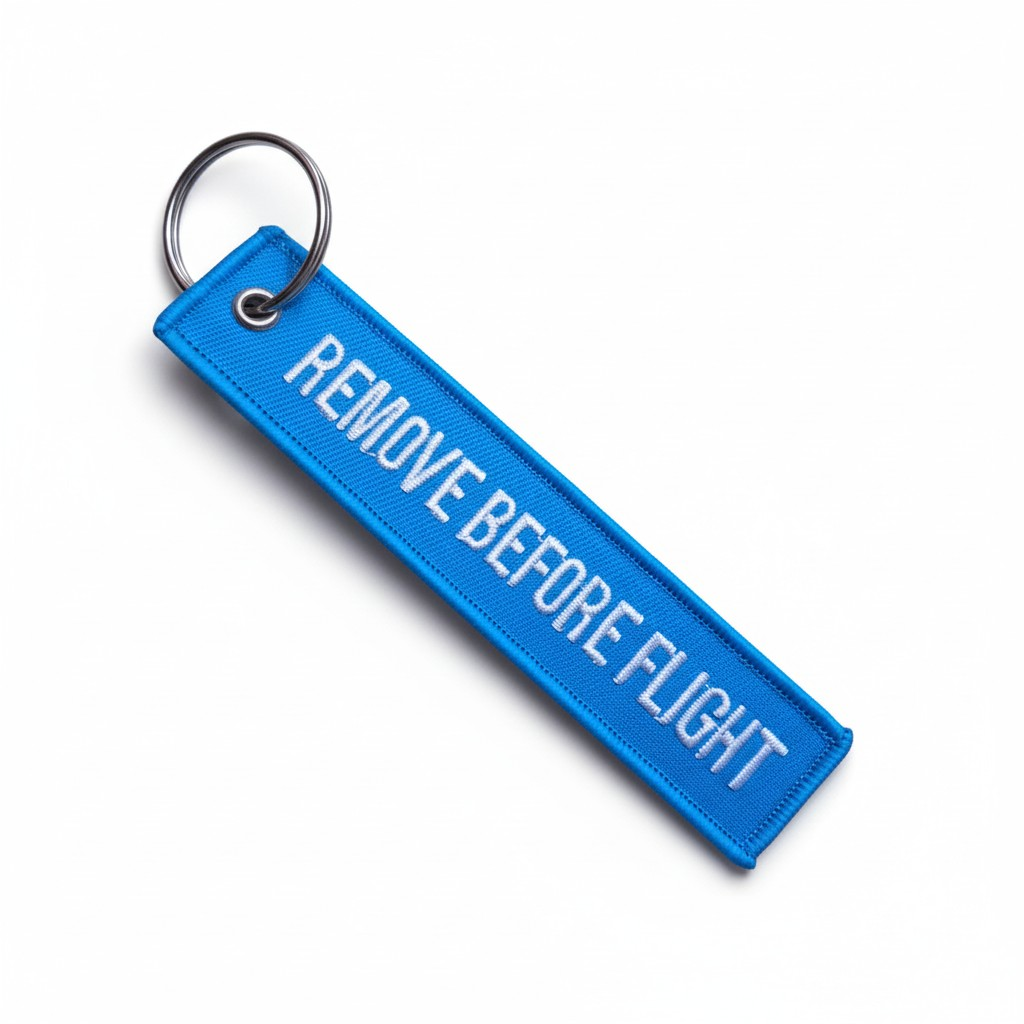 REMOVE BEFORE FLIGHT AZUL CLARO LLAVERO